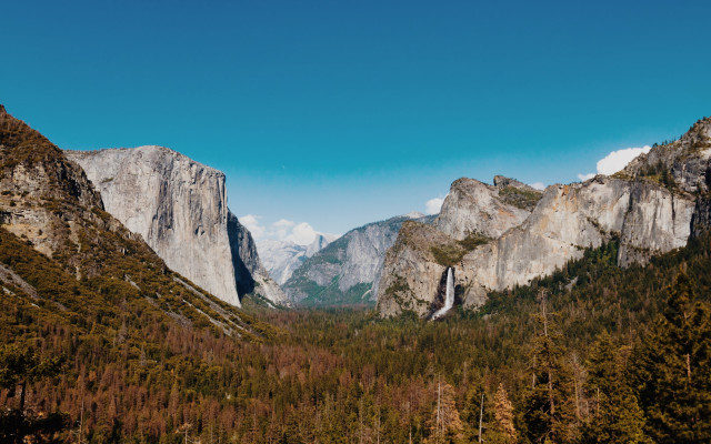 Mountain range valley forest cliff free wallpaper - medium preview image