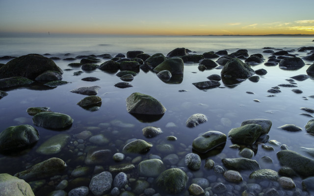 Beach rocks water lighthouse sunset free wallpaper - medium preview image