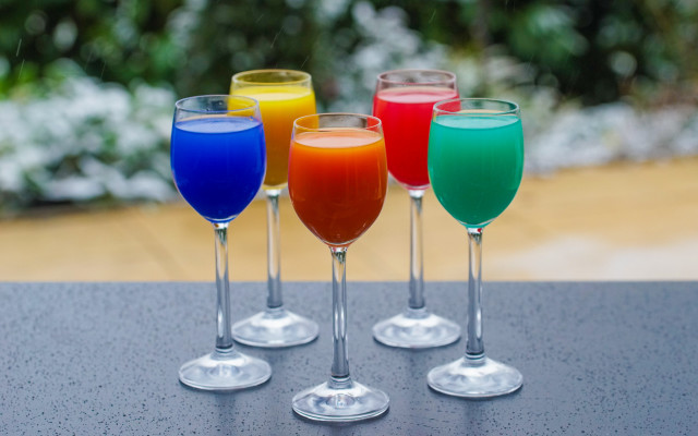 Four colored glasses table blurry free wallpaper - medium preview image