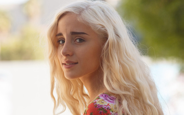 Blonde woman flower shirt serious free wallpaper - medium preview image