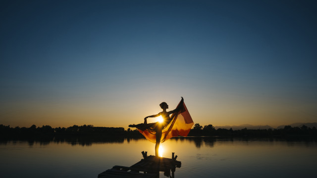 Dusk sunset flag person dock free wallpaper - medium preview image