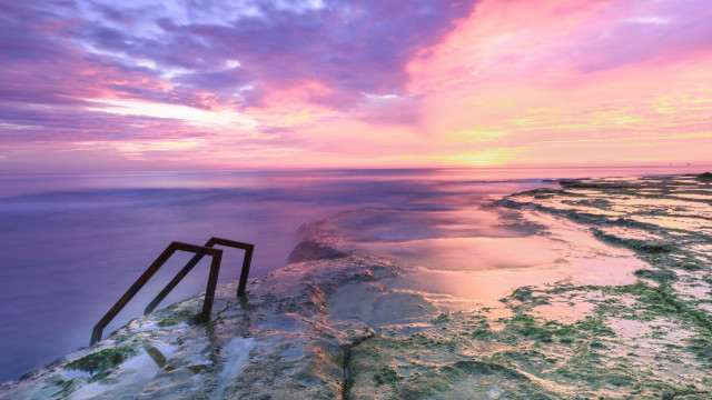 Rocky cliff sunset puzzle saturated free wallpaper - medium preview image