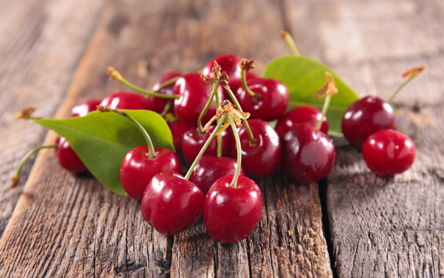 Cherries wooden table leaves blurry free wallpaper - medium preview image