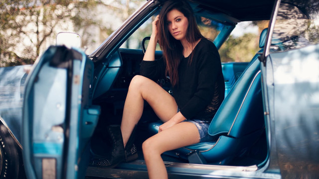 Woman sitting blue truck blurry free wallpaper - medium preview image