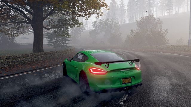 Green sports car foggy road free wallpaper - medium preview image