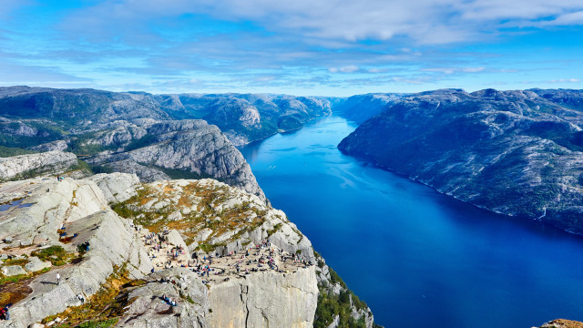Lake cliff mountains people sky free wallpaper - medium preview image