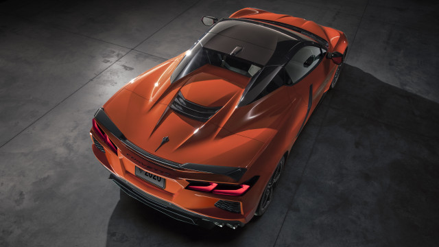 Orange sports car above dark free wallpaper - medium preview image