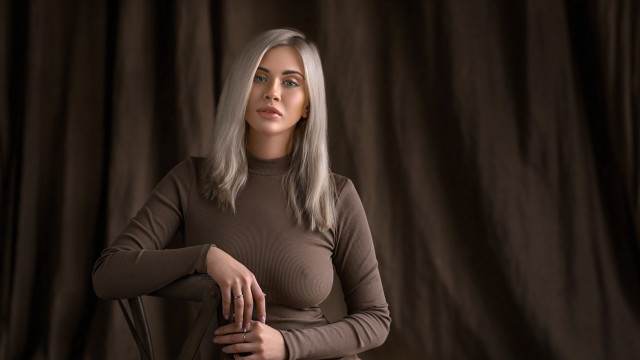 White haired woman brown shirt free wallpaper - medium preview image