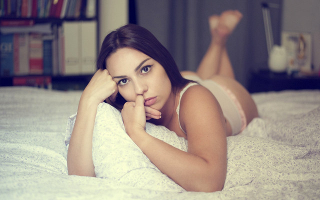 Woman laying bed blurry purple free wallpaper - medium preview image