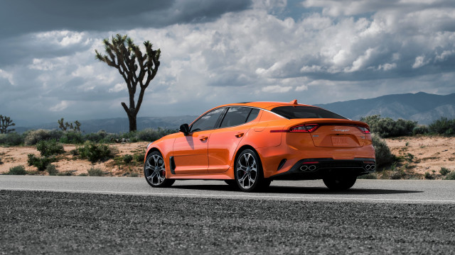 Orange sports car desert road free wallpaper - medium preview image