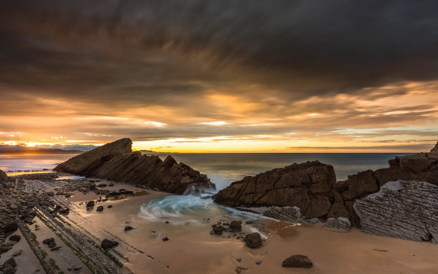 Beach rock formation water sunset free wallpaper - medium preview image