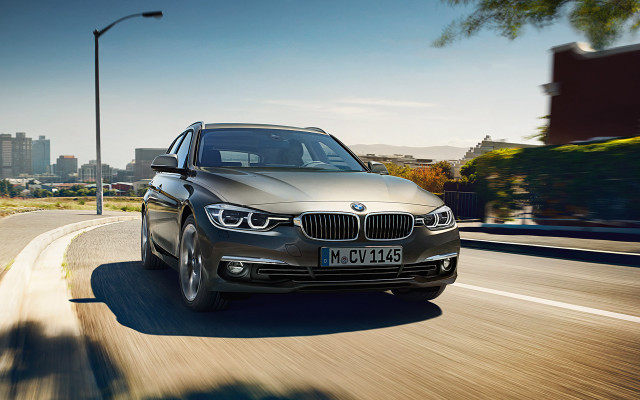 Silver car driving street tall free wallpaper - medium preview image