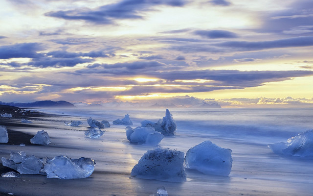 Beach ice chunks sunset clouds free wallpaper - medium preview image