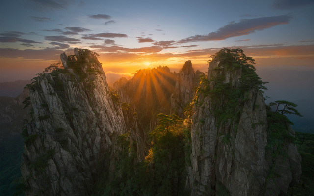 Mountain sunset trees volumetric light free wallpaper - medium preview image