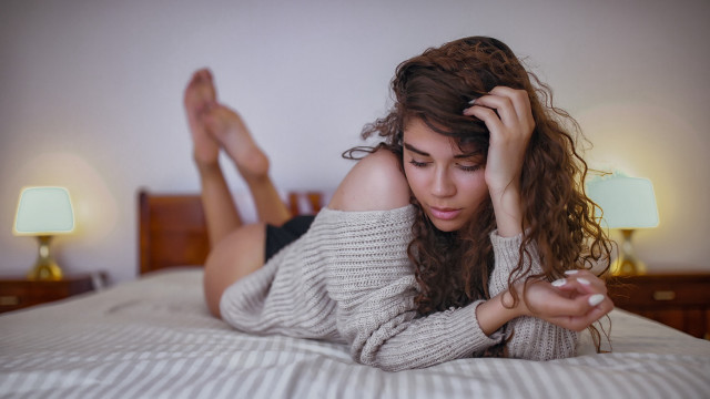 Woman laying bed curly brown free wallpaper - medium preview image