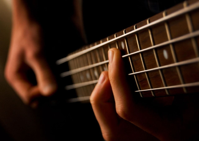 Person playing guitar fingers strings free wallpaper - medium preview image