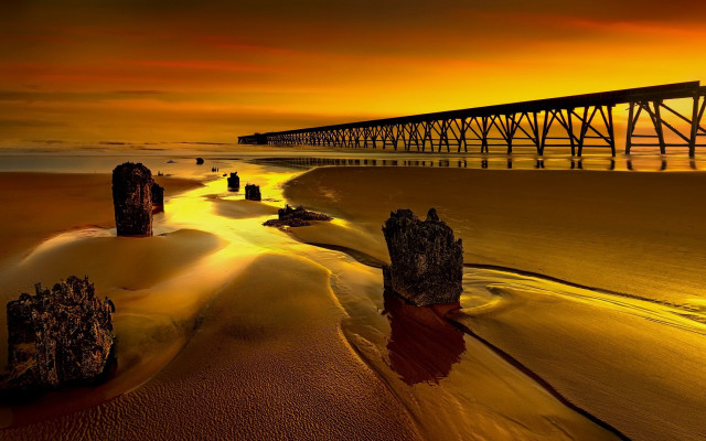 Bridge sunset beach rocks matte free wallpaper - medium preview image