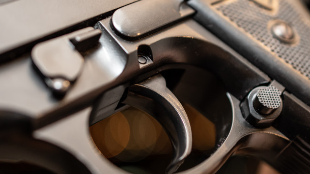 Gun black handle yellow dot free wallpaper - medium preview image