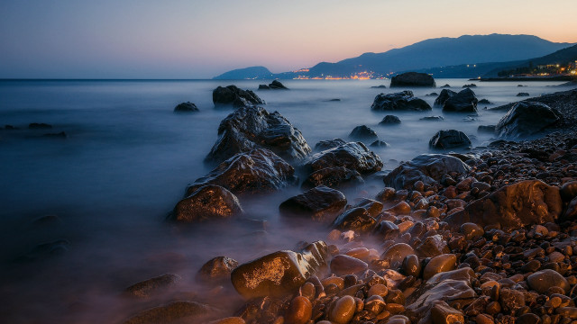 Rocky beach mountain dusk water free wallpaper - medium preview image