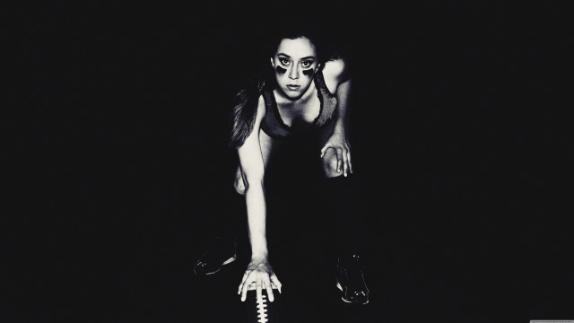 Woman black top holding white free wallpaper - medium preview image