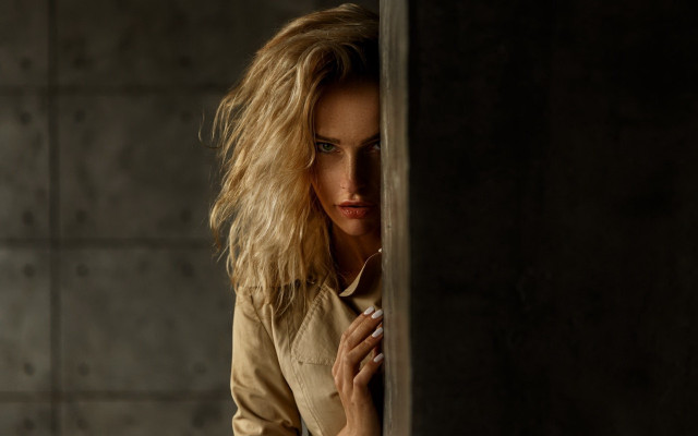 Woman leaning wall hand face free wallpaper - medium preview image