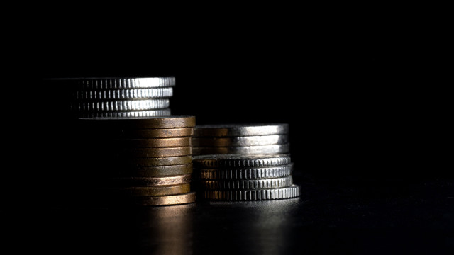 Coins stack macro shallow light free wallpaper - medium preview image