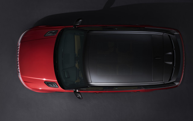 Red car tiltshift photorealism black free wallpaper - medium preview image