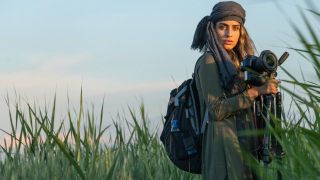 Woman camera backpack field sky free wallpaper - medium preview image
