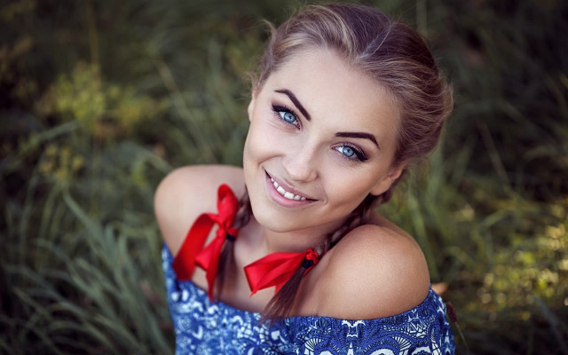 Woman red bow smiling outdoors free wallpaper - medium preview image