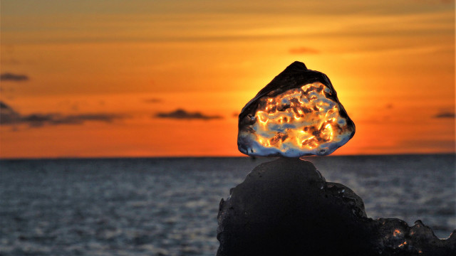 Glowing rock sunset ocean orange free wallpaper - medium preview image