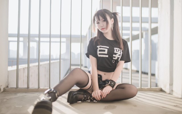 Woman black shirt boots crossed free wallpaper - medium preview image