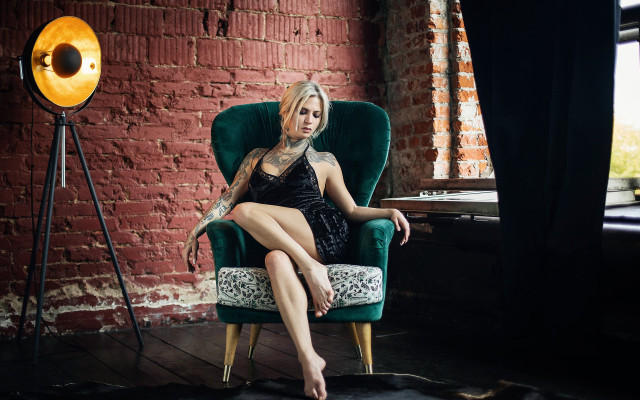 Woman tattoo chair brick wall free wallpaper - medium preview image
