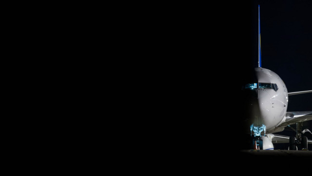 Jetliner night tarmac sky lit free wallpaper - medium preview image
