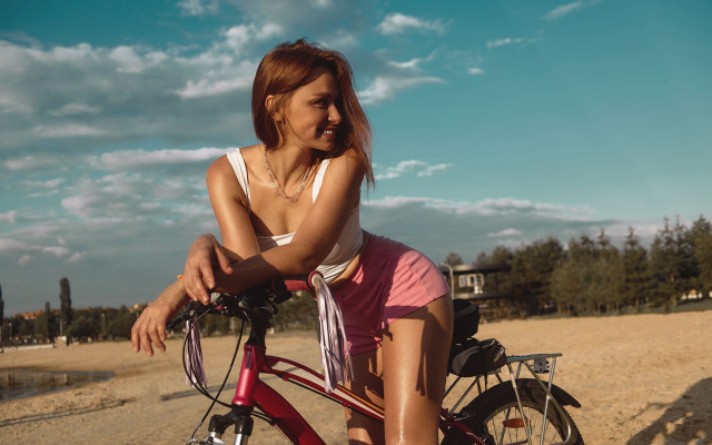 Woman bike beach sand water free wallpaper - medium preview image