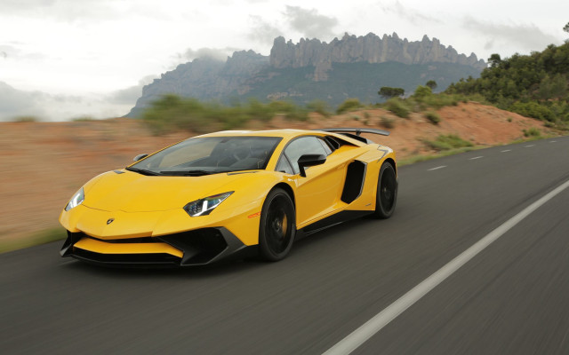 Yellow sports car mountains trees free wallpaper - medium preview image