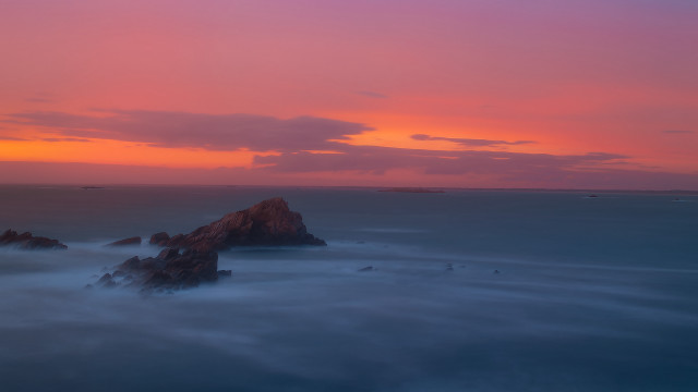 Sunset rocks ocean pink sky free wallpaper - medium preview image