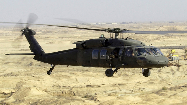 Helicopter desert landscape man standing free wallpaper - medium preview image