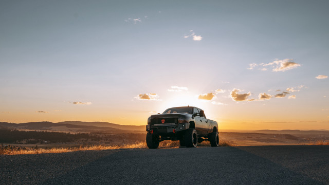 Sunset truck beach mountains ocean free wallpaper - medium preview image