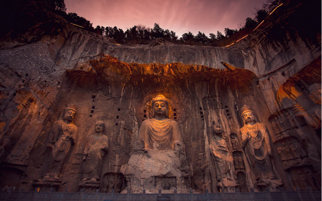 Buddha statues cave sunset flame free wallpaper - medium preview image