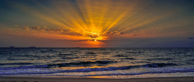 Sunset ocean boat sky crepuscular free wallpaper - medium preview image