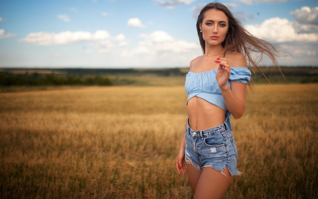 Woman blue top field wind #2 free wallpaper - medium preview image