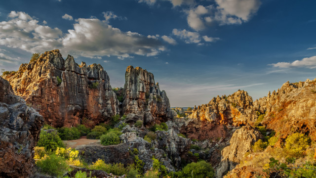 Rocky landscape trees cloudy sky free wallpaper - medium preview image
