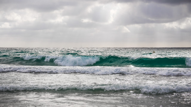 Surfboard wave ocean cloudy sky #2 free wallpaper - medium preview image