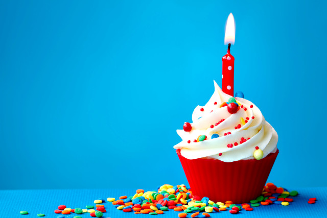 Cupcake candle sprinkles blue surface free wallpaper - medium preview image