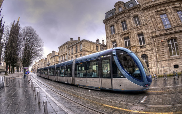 Train city building person sidewalk free wallpaper - medium preview image