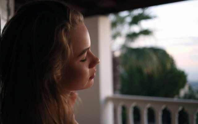 Woman ocean trees balcony shallow free wallpaper - medium preview image