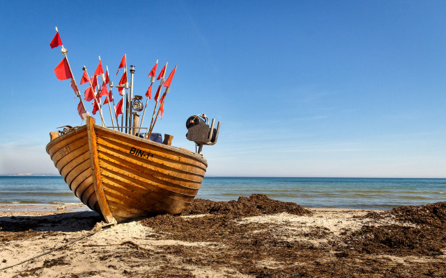 Beach boat flags ocean sky free wallpaper - medium preview image