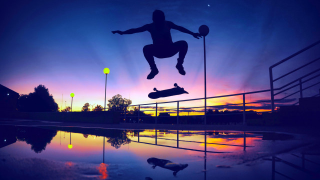 Skateboarder jumping sunset reflection graffiti free wallpaper - medium preview image