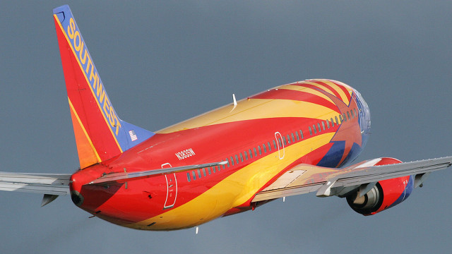 Red yellow airplane flying landing free wallpaper - medium preview image