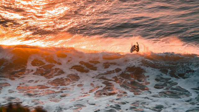 Surfing sunset ocean wave clouds free wallpaper - medium preview image